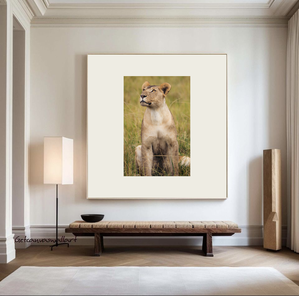 Quiet Strength lioness print in a light frame with a wide mat, hanging on a white wall